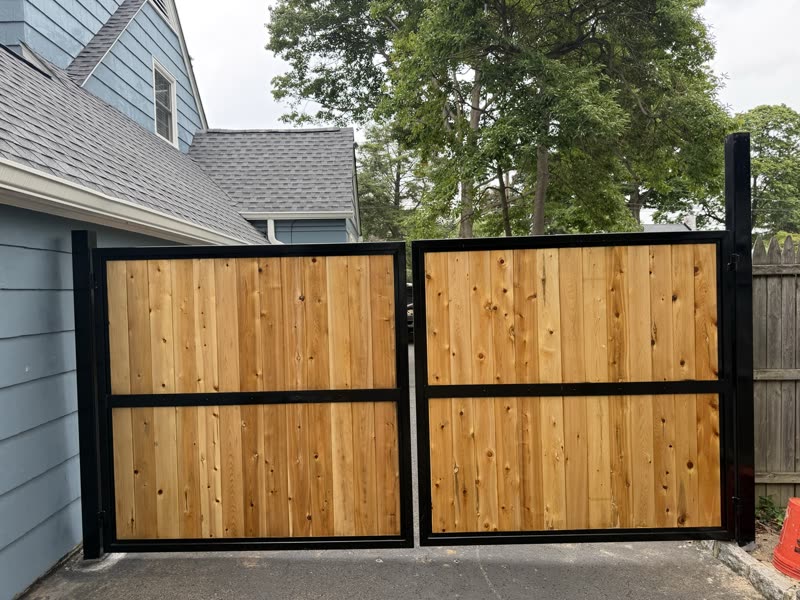Cedar and steel gate seen from the side
